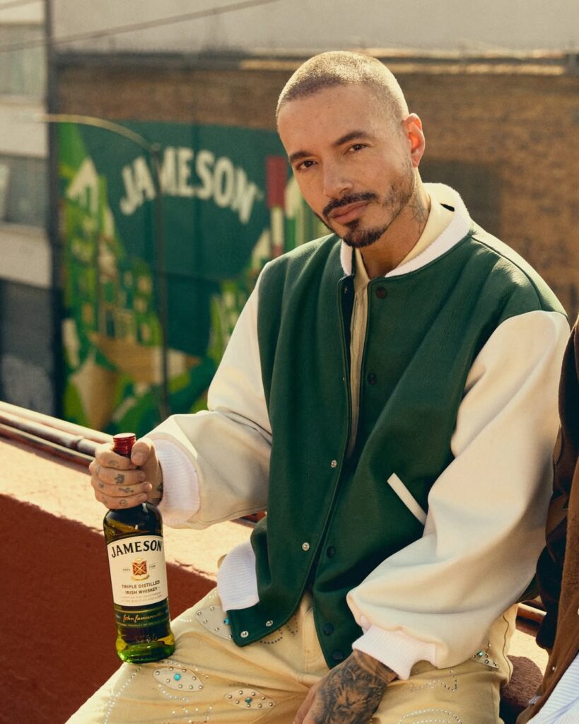 J Balvin holding a bottle of Jameson Irish Whiskey during campaign shoot