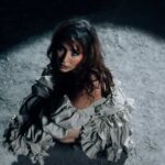 La Guru in a dark, symbolic scene from her “PEREKE” official music video