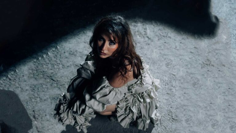 La Guru in a dark, symbolic scene from her “PEREKE” official music video