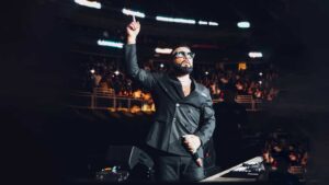 Alex Sensation on stage hosting Mega Mezcla live event