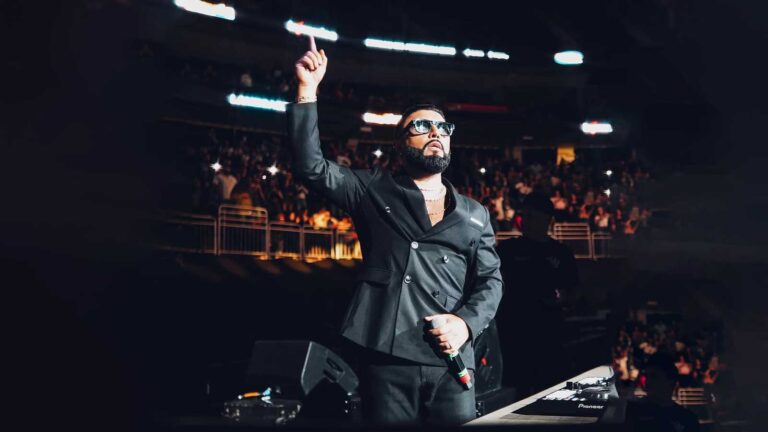 Alex Sensation on stage hosting Mega Mezcla live event