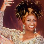 Celia Cruz performing live in iconic gold outfit during her career peak
