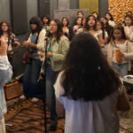 Lenny Tavárez performing “PA’ LO BONITO” with students at the Boys & Girls Club in Mexico City.