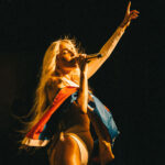 Elena Rose performing during her European tour while supporting humanitarian initiatives for Venezuela.