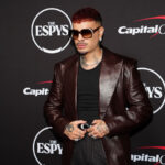Rauw Alejandro posing on the red carpet at the 2026 ESPY Awards.