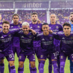 Orlando City players celebrating a goal during an MLS home match in Orlando.