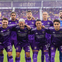 Orlando City players celebrating a goal during an MLS home match in Orlando.