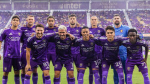 Orlando City players celebrating a goal during an MLS home match in Orlando.