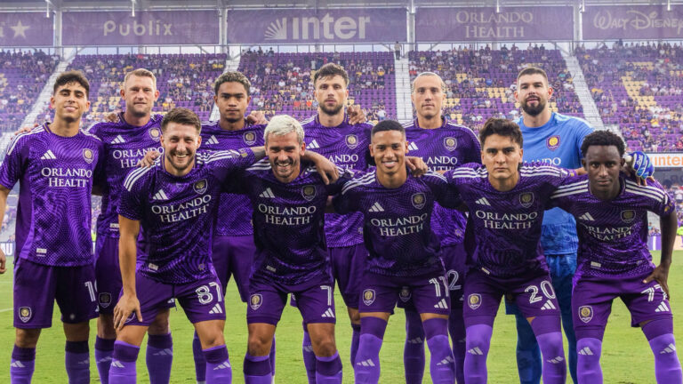 Orlando City players celebrating a goal during an MLS home match in Orlando.