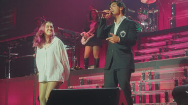 ELA Taubert joins Joe Jonas and the Jonas Brothers onstage during their sold-out Miami concert.