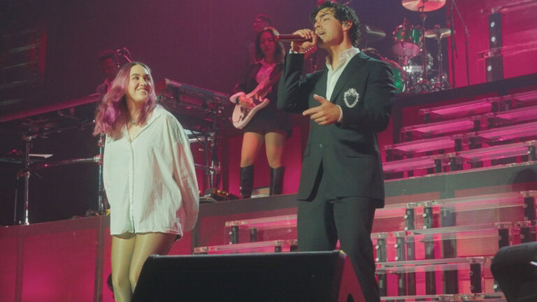 ELA Taubert joins Joe Jonas and the Jonas Brothers onstage during their sold-out Miami concert.